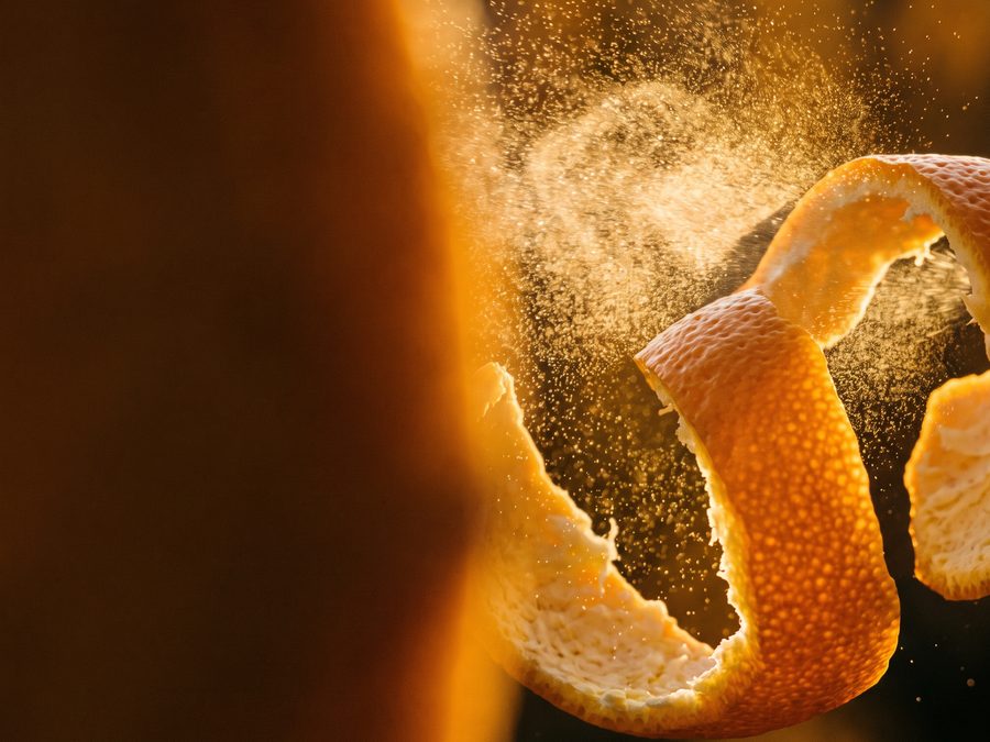 Sweet orange zest curl releasing backlit citrus oil